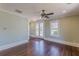This bedroom has hardwood floors, white trim and glass doors to the outside patio at 1763 Mercer Ave, Atlanta, GA 30337