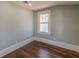 Bright, carpetless bedroom features ample natural light from a large window at 1763 Mercer Ave, Atlanta, GA 30337