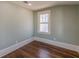 Cozy bedroom with hardwood floors, natural light, and neutral paint at 1763 Mercer Ave, Atlanta, GA 30337