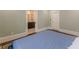 Stylish bedroom with hardwood floors and ensuite bathroom with a tiled floor at 1763 Mercer Ave, Atlanta, GA 30337