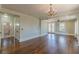 Large bedroom space with hardwood floors, chandelier and easy access to the bathroom at 1763 Mercer Ave, Atlanta, GA 30337