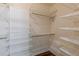 Spacious closet with multiple built-in shelving units providing plentiful storage and hardwood floors at 1763 Mercer Ave, Atlanta, GA 30337