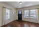 Bright entryway with hardwood floors, natural light, and a stylish front door at 1763 Mercer Ave, Atlanta, GA 30337