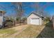Detached garage, perfect for extra storage or parking, surrounded by a wrought iron fence at 1763 Mercer Ave, Atlanta, GA 30337