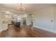 Open kitchen and living area with hardwood floors and natural light at 1763 Mercer Ave, Atlanta, GA 30337