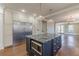 Spacious kitchen island with stone countertops and stainless steel appliances at 1763 Mercer Ave, Atlanta, GA 30337