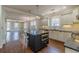 Open kitchen with a center island, stainless steel appliances, and open to another living space at 1763 Mercer Ave, Atlanta, GA 30337
