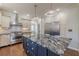 Contemporary kitchen with stainless steel appliances and a large island with seating at 1763 Mercer Ave, Atlanta, GA 30337
