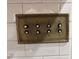 Close up of a vintage, ornate light switch with multiple toggle switches and decorative detailing at 1763 Mercer Ave, Atlanta, GA 30337