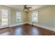 Bright living room featuring hardwood floors, door to the outside, and natural lighting at 1763 Mercer Ave, Atlanta, GA 30337