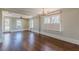 Open living area with hardwood floors, chandelier, and access to the outdoors at 1763 Mercer Ave, Atlanta, GA 30337
