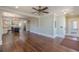 Open-plan living area showcasing wood floors, recessed lighting, and kitchen access at 1763 Mercer Ave, Atlanta, GA 30337