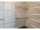 Large walk-in closet providing organized storage with custom shelving units at 1763 Mercer Ave, Atlanta, GA 30337