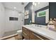 Modern bathroom featuring a walk-in shower, wood vanity, and white subway tile at 3314 Creatwood Se Trl, Smyrna, GA 30080
