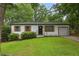 Charming single-story home with a well-manicured front yard and attached garage at 3314 Creatwood Se Trl, Smyrna, GA 30080