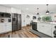 Bright kitchen featuring stainless steel appliances, white cabinets, and open design at 3314 Creatwood Se Trl, Smyrna, GA 30080