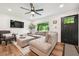 Cozy living room with comfortable seating, hardwood floors, and natural light at 3314 Creatwood Se Trl, Smyrna, GA 30080