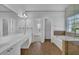 Elegant bathroom with double vanity, soaking tub, and glass-enclosed shower, offering a spa-like experience at 6640 Grove Crossing Ct, Cumming, GA 30028