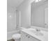 Clean bathroom featuring tub-shower combo and vanity sink at 6640 Grove Crossing Ct, Cumming, GA 30028