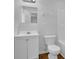 Bathroom features a sleek white vanity, toilet, and tub/shower combination at 6640 Grove Crossing Ct, Cumming, GA 30028