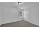 Cozy bedroom with neutral colors, carpeted floors, and a double door closet at 6640 Grove Crossing Ct, Cumming, GA 30028
