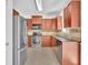 Well-equipped kitchen featuring stainless steel appliances and granite countertops at 6640 Grove Crossing Ct, Cumming, GA 30028