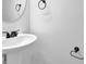Elegant powder room featuring pedestal sink and classic design at 6640 Grove Crossing Ct, Cumming, GA 30028