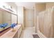 Comfortable bathroom with large vanity and a shower/tub combo at 1352 Orchard Park Dr, Stone Mountain, GA 30083