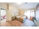 Bright bedroom with adjoining office space, ensuite bath, and wood-look flooring at 1352 Orchard Park Dr, Stone Mountain, GA 30083