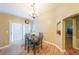 Bright dining area features wood floors, chandelier, and door to the outside at 1352 Orchard Park Dr, Stone Mountain, GA 30083
