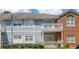 Exterior view of the apartment shows brick and siding construction and balcony at 1352 Orchard Park Dr, Stone Mountain, GA 30083