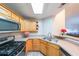 Well-lit kitchen area with stainless steel appliances and light wood cabinetry at 1352 Orchard Park Dr, Stone Mountain, GA 30083