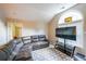 Comfortable living room boasts large window, vaulted ceiling, and soft, gray couches at 1352 Orchard Park Dr, Stone Mountain, GA 30083