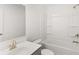Bright bathroom featuring modern vanity, bathtub, and shower combination at 1861 Lacebark Elm Way, Lawrenceville, GA 30045