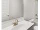 Clean, modern bathroom with white countertop, sink, gold faucet, and shower/tub combination at 1861 Lacebark Elm Way, Lawrenceville, GA 30045
