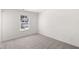 Bedroom with carpeted floors and window, offering comfortable space at 1861 Lacebark Elm Way, Lawrenceville, GA 30045