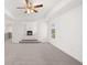 Cozy bedroom featuring plush carpet, trey ceilings and view to living room with fireplace at 1861 Lacebark Elm Way, Lawrenceville, GA 30045