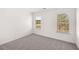 Well-lit bedroom showcasing natural light and a neutral color palette at 1861 Lacebark Elm Way, Lawrenceville, GA 30045