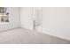 Bright bedroom with carpeted floors and window, offering comfortable space at 1861 Lacebark Elm Way, Lawrenceville, GA 30045