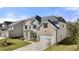 Beautiful two-story home with brick accents, a well-manicured lawn, and attached garage at 1861 Lacebark Elm Way, Lawrenceville, GA 30045