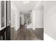 Inviting foyer with hardwood floors, white walls, and a staircase at 1861 Lacebark Elm Way, Lawrenceville, GA 30045