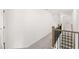Hallway with view of the stairway features modern railings, and carpeted floors at 1861 Lacebark Elm Way, Lawrenceville, GA 30045