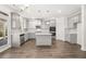 Modern kitchen with stainless steel appliances, gray cabinets, and a center island at 1861 Lacebark Elm Way, Lawrenceville, GA 30045