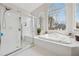 Bathroom features soaking tub, glass shower, and lots of sunlight at 551 Straton Chase Se, Marietta, GA 30067