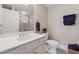 Bright bathroom with vanity, framed mirror, and tiled walk-in shower behind a glass door at 551 Straton Chase Se, Marietta, GA 30067