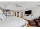 Well-lit main bedroom with neutral walls, hardwood floors, tray ceilings, and a ceiling fan at 551 Straton Chase Se, Marietta, GA 30067