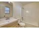 Clean and bright bathroom with a modern vanity and shower-tub combination at 61 Andrew Rd, Covington, GA 30016