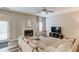 Comfortable living room with a fireplace, plush sectional sofa, and neutral decor at 114 Farm Valley Dr, Canton, GA 30115