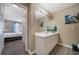 Bathroom with white vanity and view into the main bedroom at 5099 Leeshire Trce, Tucker, GA 30084