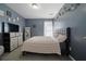 Bedroom with gray walls, plush carpet, and full dresser at 5099 Leeshire Trce, Tucker, GA 30084